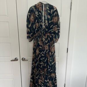 Breezy, romantic maxi dress. Low cut in front and key hole back.